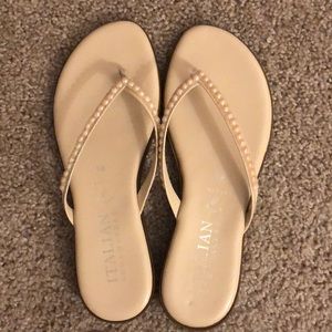 Pink leather flip flops